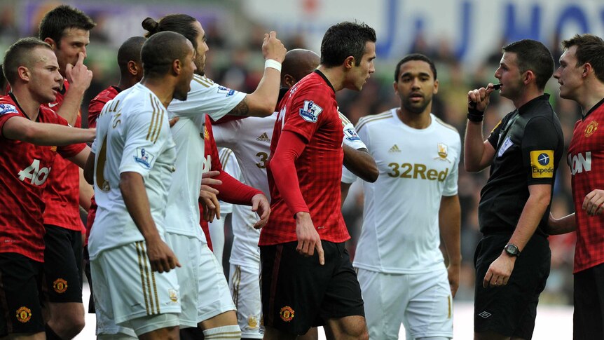 Foul play? ... Robin van Persie rages after clashing with Swansea's Ashley Williams.