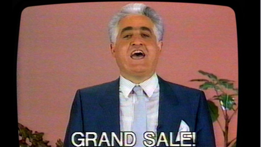 Franco Cozzo on television with the words GRAND SALE! superimposed.