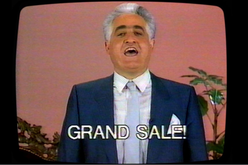 Franco Cozzo on television with the words GRAND SALE! superimposed.