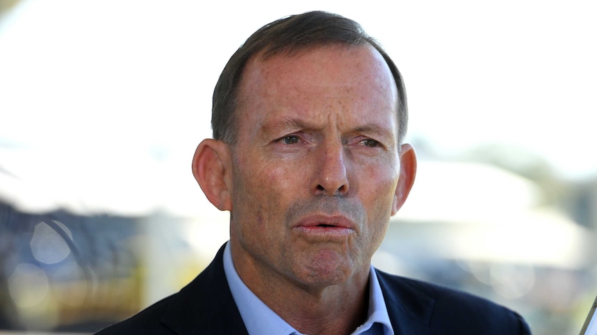 A headshot of  Tony Abbott while speaking to media.