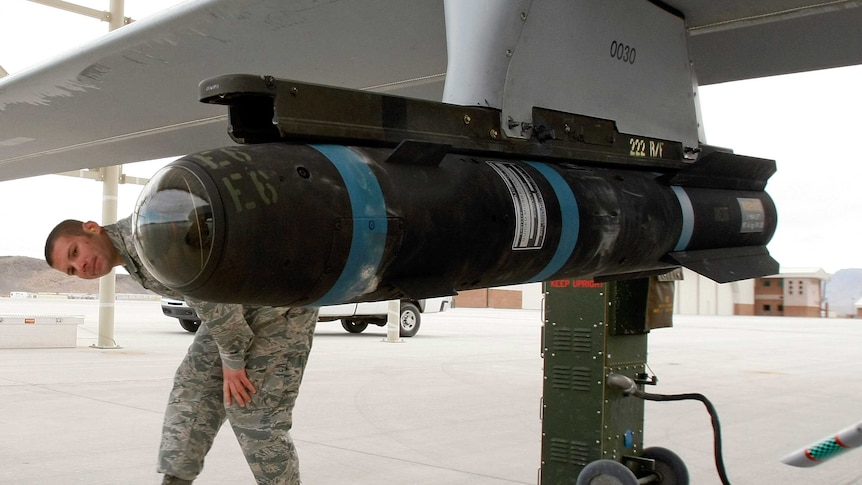A US soldier checks on a hellfire missile
