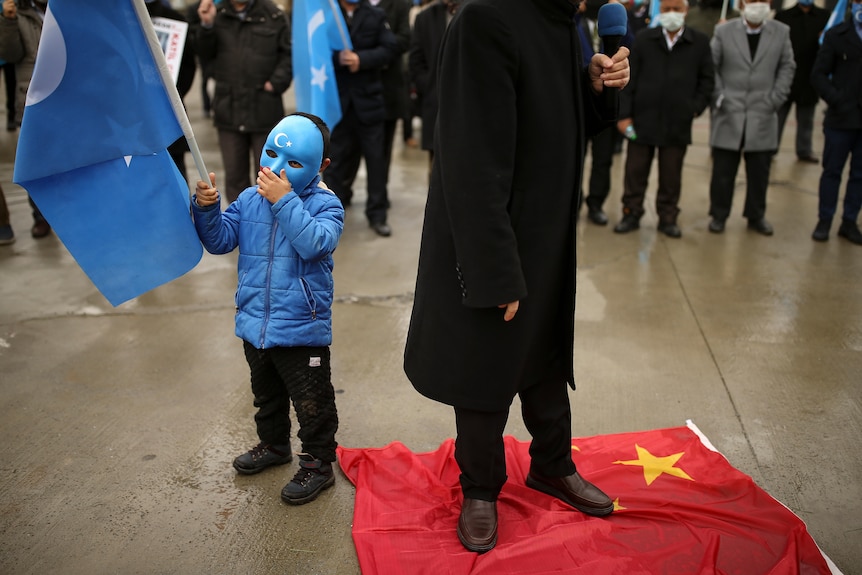 Protesters from the Uyghur community living in Turkey step on a Chinese flag