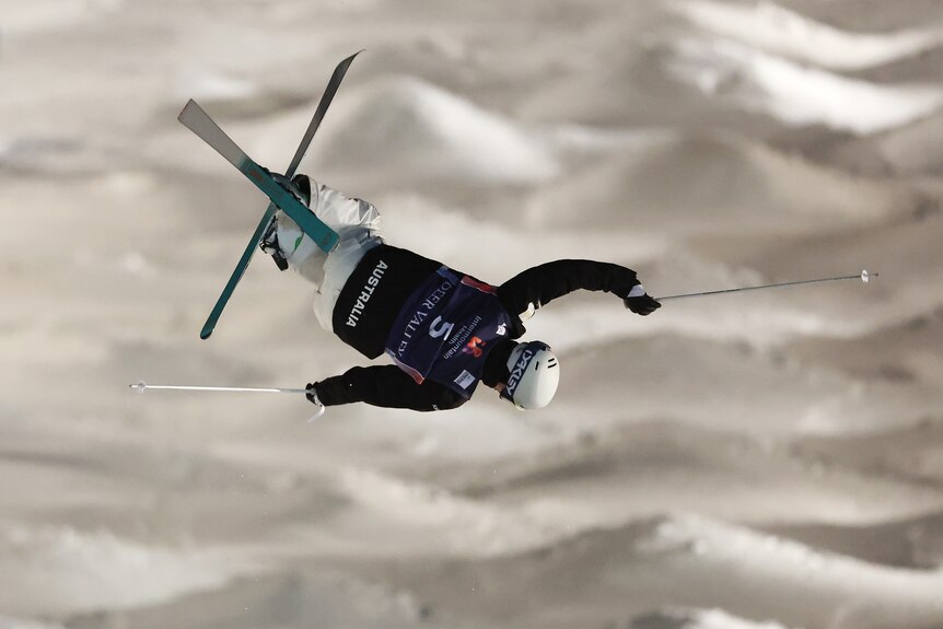 Matt Graham jumps with his skis crossed