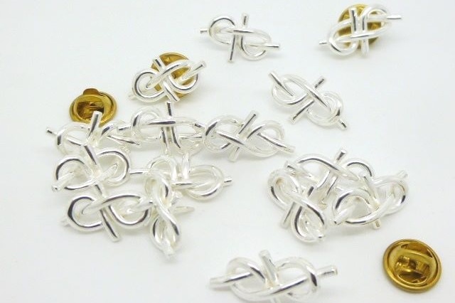 Silver hat pins shaped in figure eights
