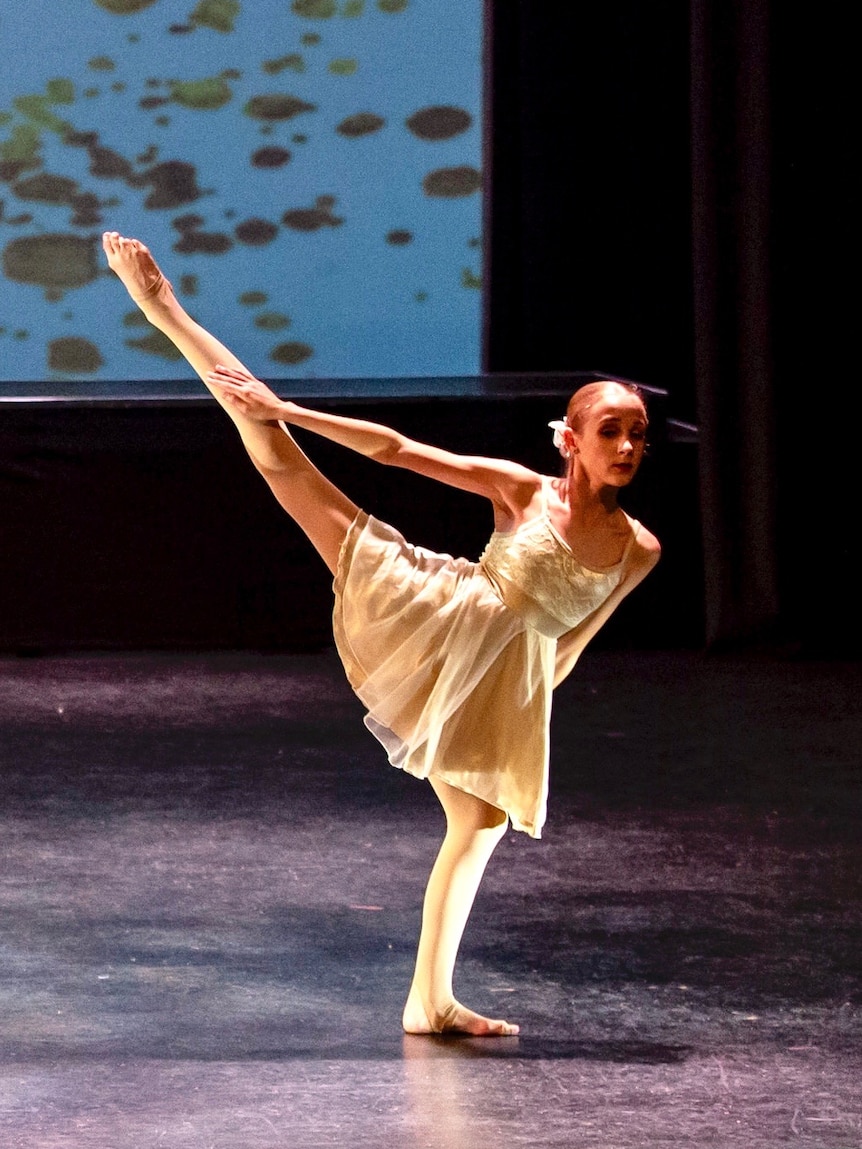 Young girl dancing on stage