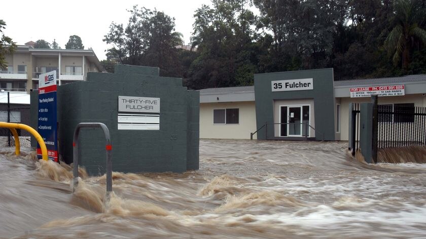 High water: flooding from Ithaca Creek inundates Red Hill businesses.