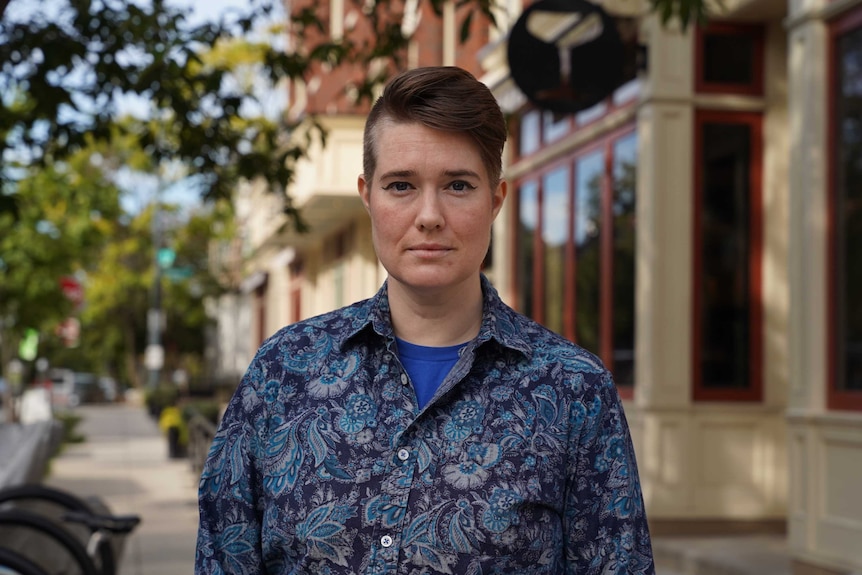 A person standing on a DC street looking strong