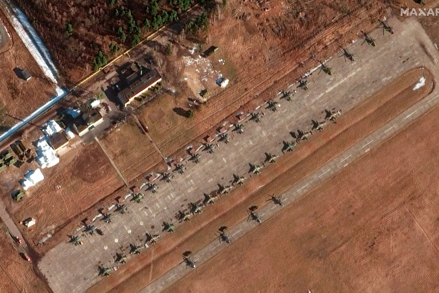 Aerial view of attack aircraft, helicopters, ground force equipment and a drone unit