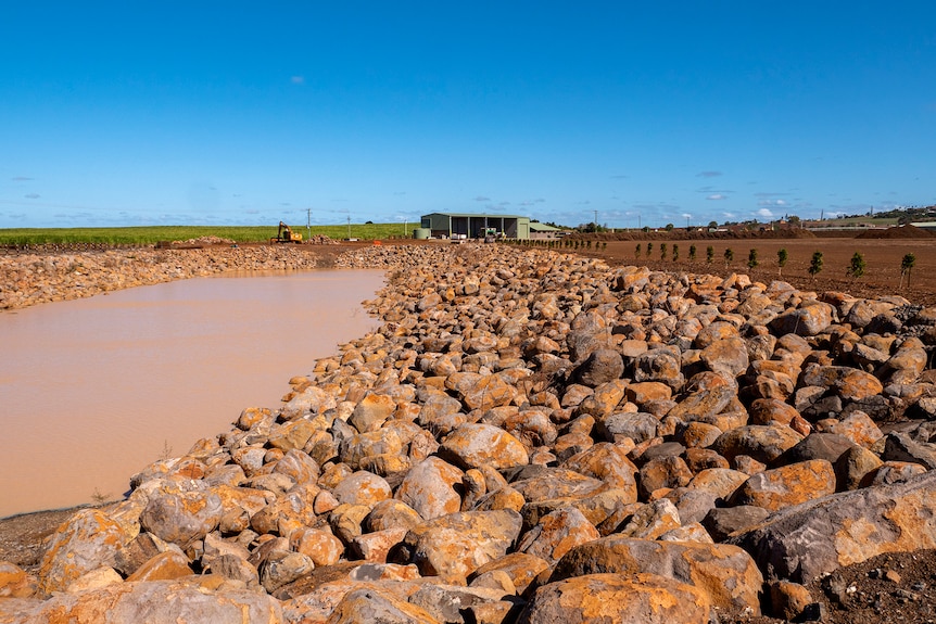 A large dam surrounded by rocks