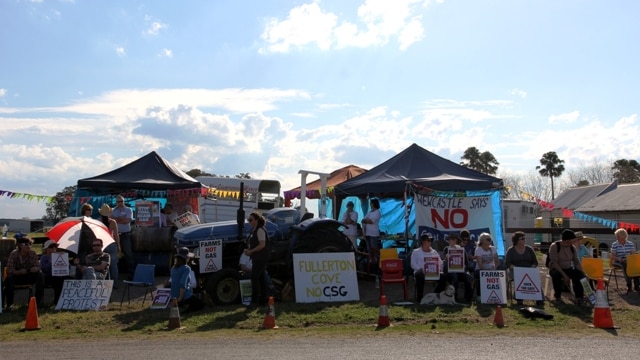 Protesters gather outside the entrance to the drill site at Fullerton Cove, just metres away from Ms Dylan-Smith's house.