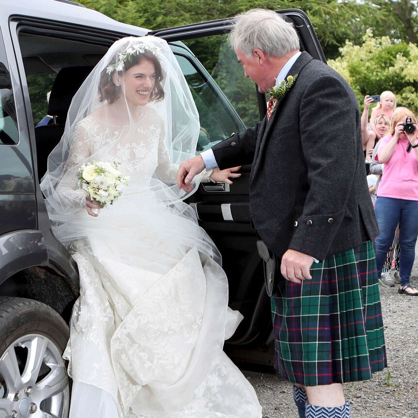 Actress Rose Leslie is escorted by her father Sebastian