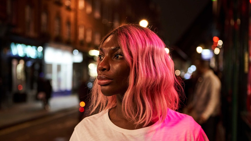 A scene from the TV series I May Destroy You with Michaela Coel, it's night and she's out on a London street