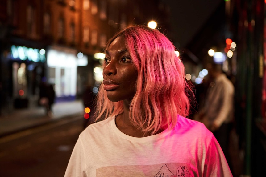 A scene from the TV series I May Destroy You with Michaela Coel, it's night and she's out on a London street