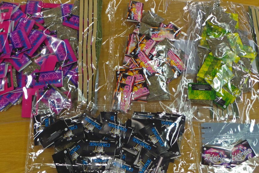 A total of 520 synthetic drug packets were seized by police during raids.