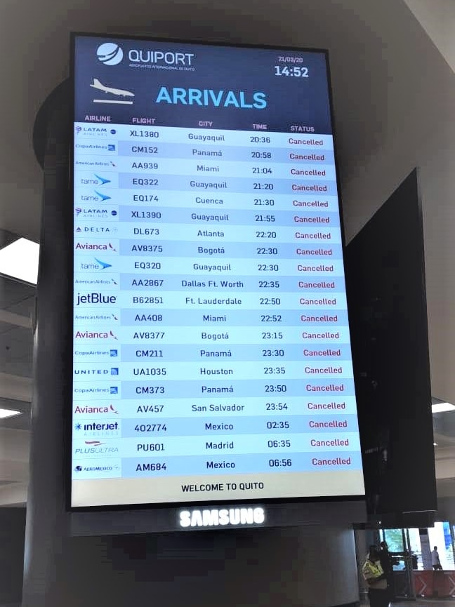 An arrivals sign in an airport with all flights cancelled