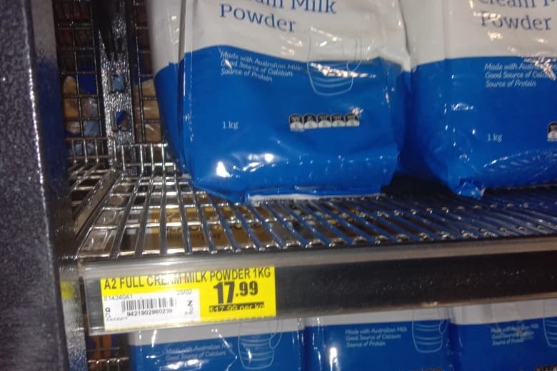 plastic packets of powdered milk on a shelf