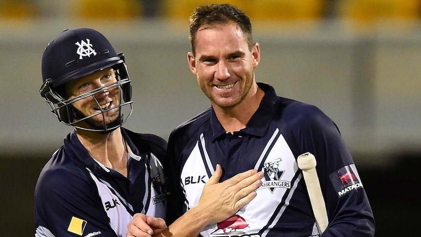 Cameron White and John Hastings celebrate Victoria's win