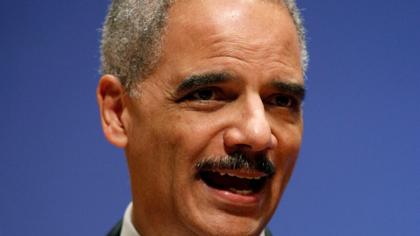 Eric Holder delivers a speech