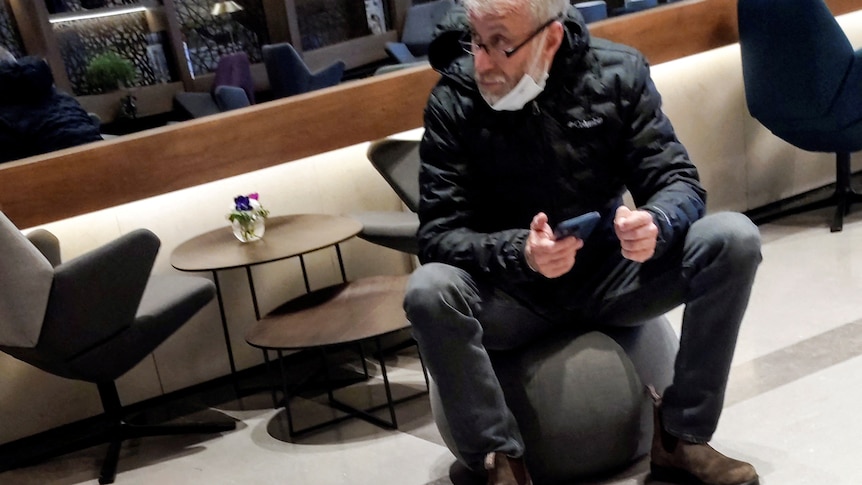 Roman Abramovich sitting in an airport lounge. 