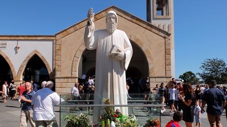 Statue of 19th century Lebanese monk and priest St Charbel outside of church.