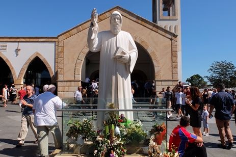 Statue of 19th century Lebanese monk and priest St Charbel outside of church.