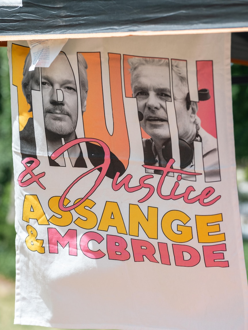A tea towel with the words "TRUTH & Justice Assange & McBride" with pictures of the men.