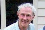 A head and shoulder shot of Roy Arbon standing in front of a house.