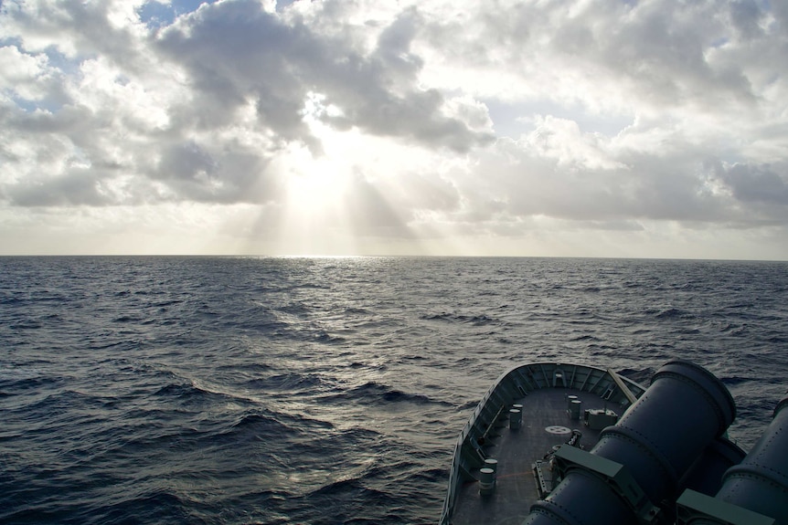 The Sun shines over HMAS Arunta as it patrols the Indian Ocean, on the lookout for drug smugglers.