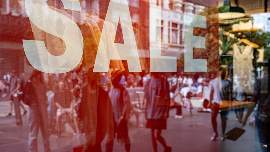 A sale sign in a window