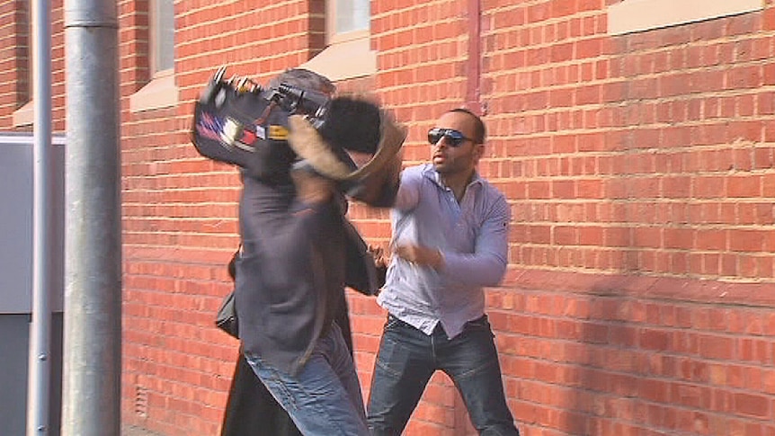 There was an altercation between the cameraman and a man leaving the court