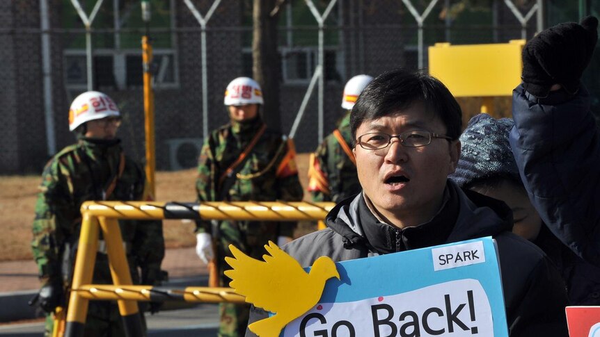 S Korean anti-war activist protests against further military exercises.