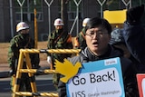 S Korean anti-war activist protests against further military exercises.