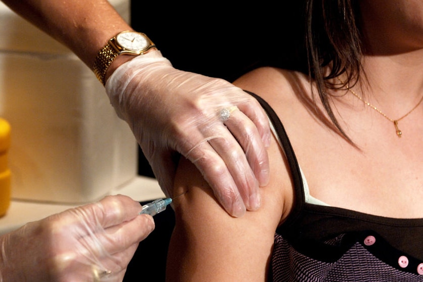 Woman getting a vaccination