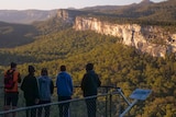 Five people look over Carnarvon Gorge.