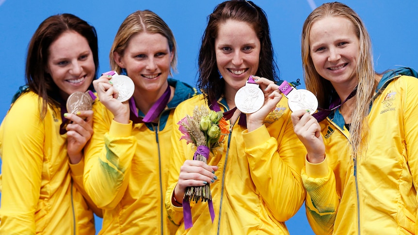 Emily Seebohm, Leisel Jones, Alicia Coutts and Melanie Schlanger pose with the silver medals.