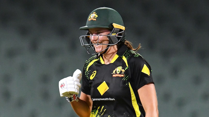 An Australian batter celebrates after her side beat England in a women's T20 international.