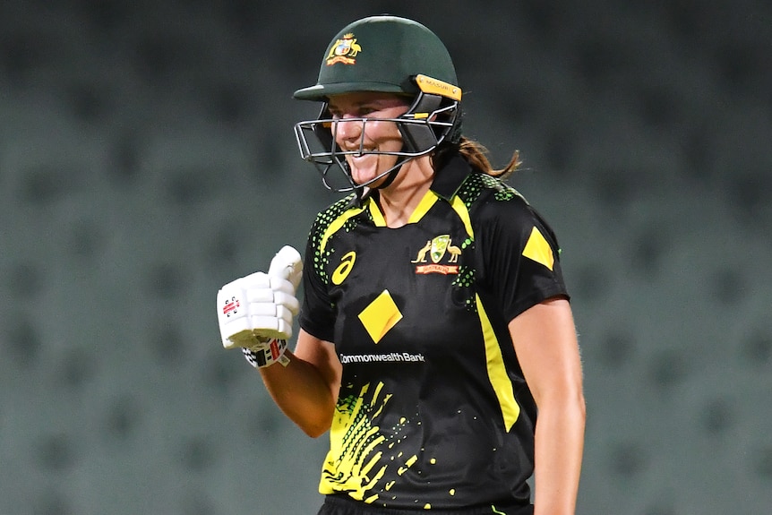 An Australian batter celebrates after her side beat England in a women's T20 international.