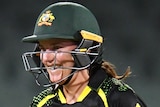 An Australian batter celebrates after her side beat England in a women's T20 international.