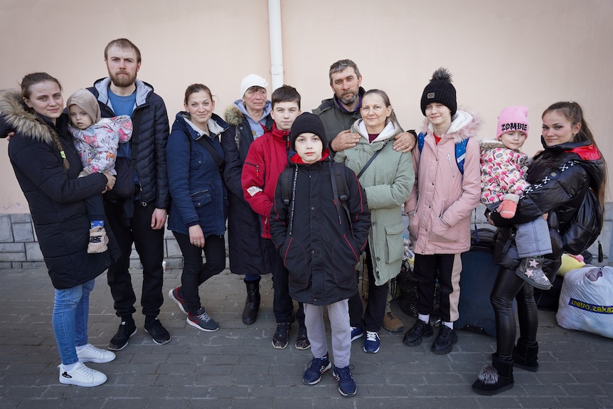 A group shot includes 12 of the family members 