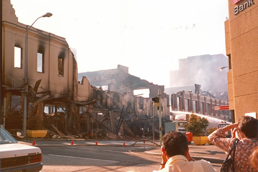 Onlookers watch on after a fire in 1985 destroyed Ipswich department store Reids, formerly Cribb and Foote.