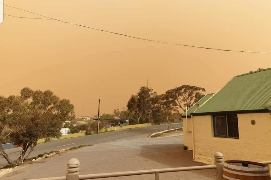 Orange sky over a town