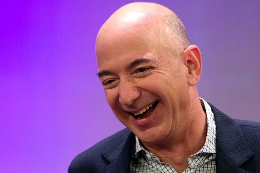 Jeff Bezos laughing.
