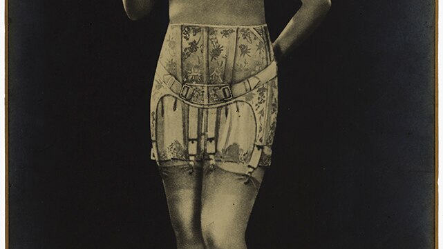 Woman wearing a Jenyns surgical support belt ca. 1920