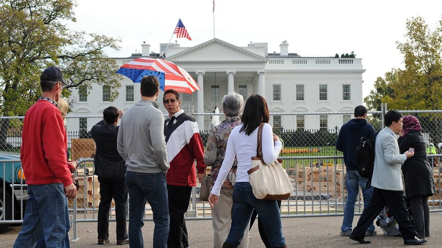 Tourists gather outside the White House in Washington