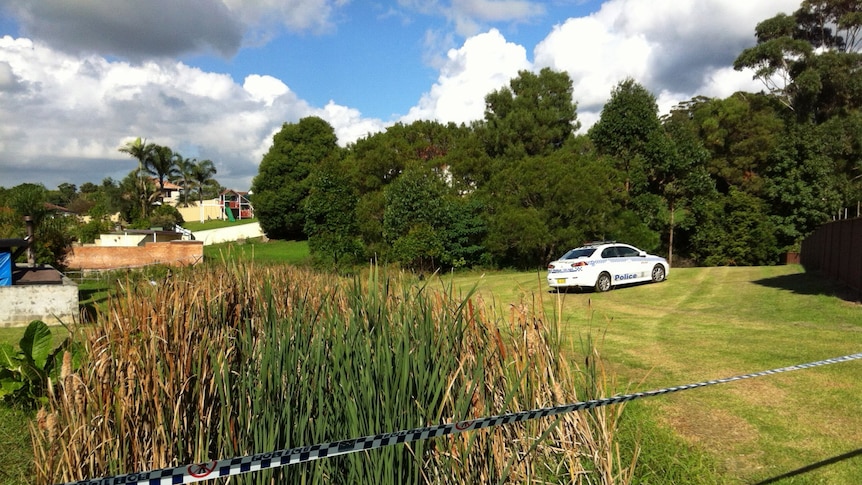 A woman's body has been found in a car at Corrimal