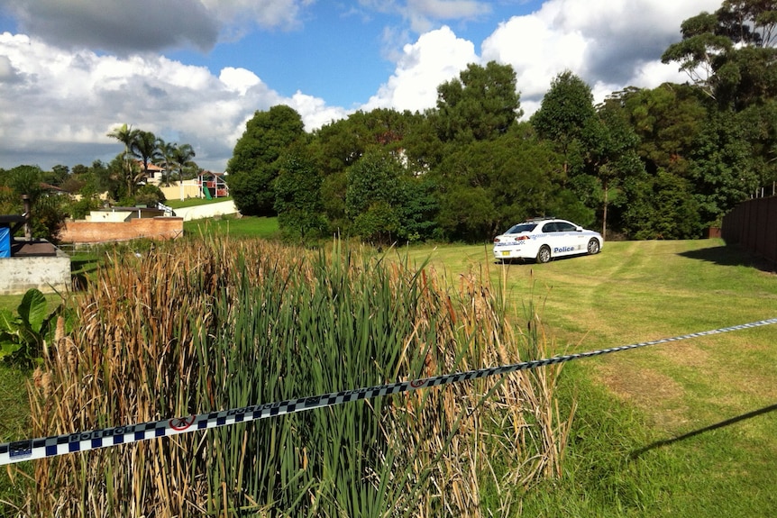 A woman's body has been found in a car at Corrimal