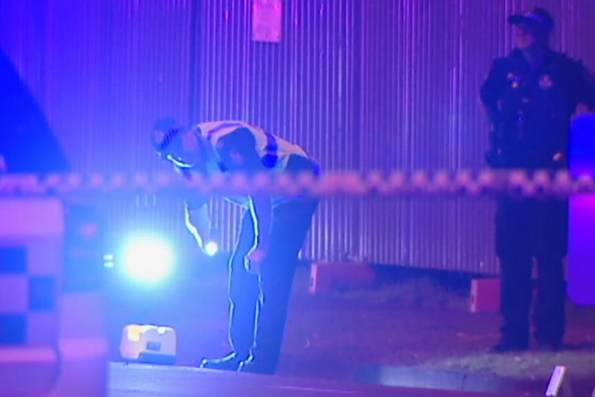 Police shine a light over the fatal crash scene at Broadbeach