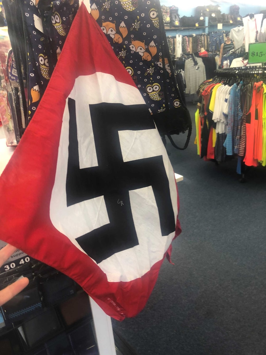 Bandanas emblazoned with the Nazi emblem were 'mistakenly' for sale at a clothing store in Kununurra.