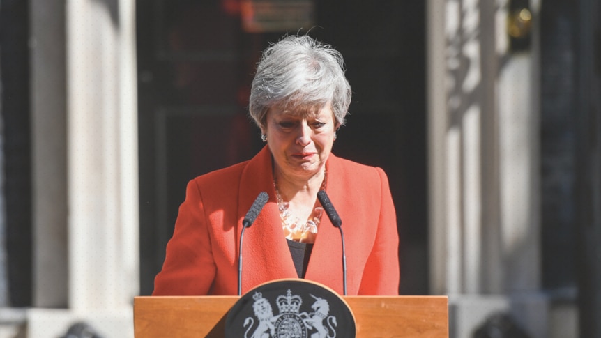 Theresa May stands behind a lectern in front of Downing Street.