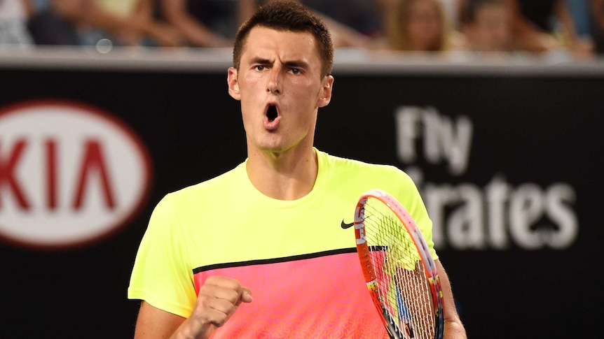 Bernard Tomic celebrates at the Australian Open